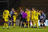 Alex Mowatt of Barnsley FC is shown a red card during the Sky Bet Championship match between Wycombe Wanderers and Barnsley.