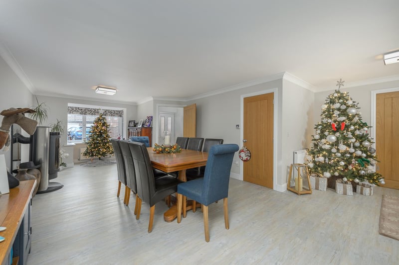 The dining space benefits from a Swedish style log burner and is adjoined to the main living area with open-plan access.