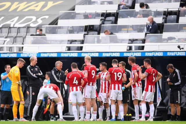 Sheffield United boss Chris WIlder speaks to his players during the defeat to Newcastle United on Sunday (Photo by LAURENCE GRIFFITHS/POOL/AFP via Getty Images)