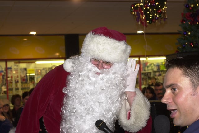 Santa with Kingdom FM's Ian Gilmour at the 2002 Christmas lights switch on at the Kingdom Centre, Glenrothes (Pic: Fife Free Press)
