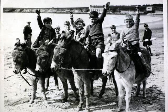 Youngsters all set for a donkey ride on the sands at Barry Island. (Photo by Hulton Archive/Getty Images)