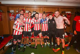 John Fleck (second left), Oliver Norwood (centre), Ben Osborn (second right) and Oli McBurnie (right) celebrate Sheffield United's promotion: Simon Bellis / Sportimage