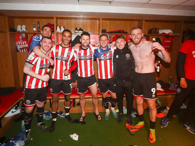 John Fleck (second left), Oliver Norwood (centre), Ben Osborn (second right) and Oli McBurnie (right) celebrate Sheffield United's promotion: Simon Bellis / Sportimage