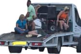 A group of people were filmed gathered around a barbecue on the back of a moving flat bed truck in South Yorkshire.