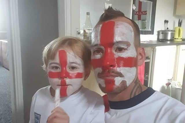 Face paint at the ready for these two football fans.