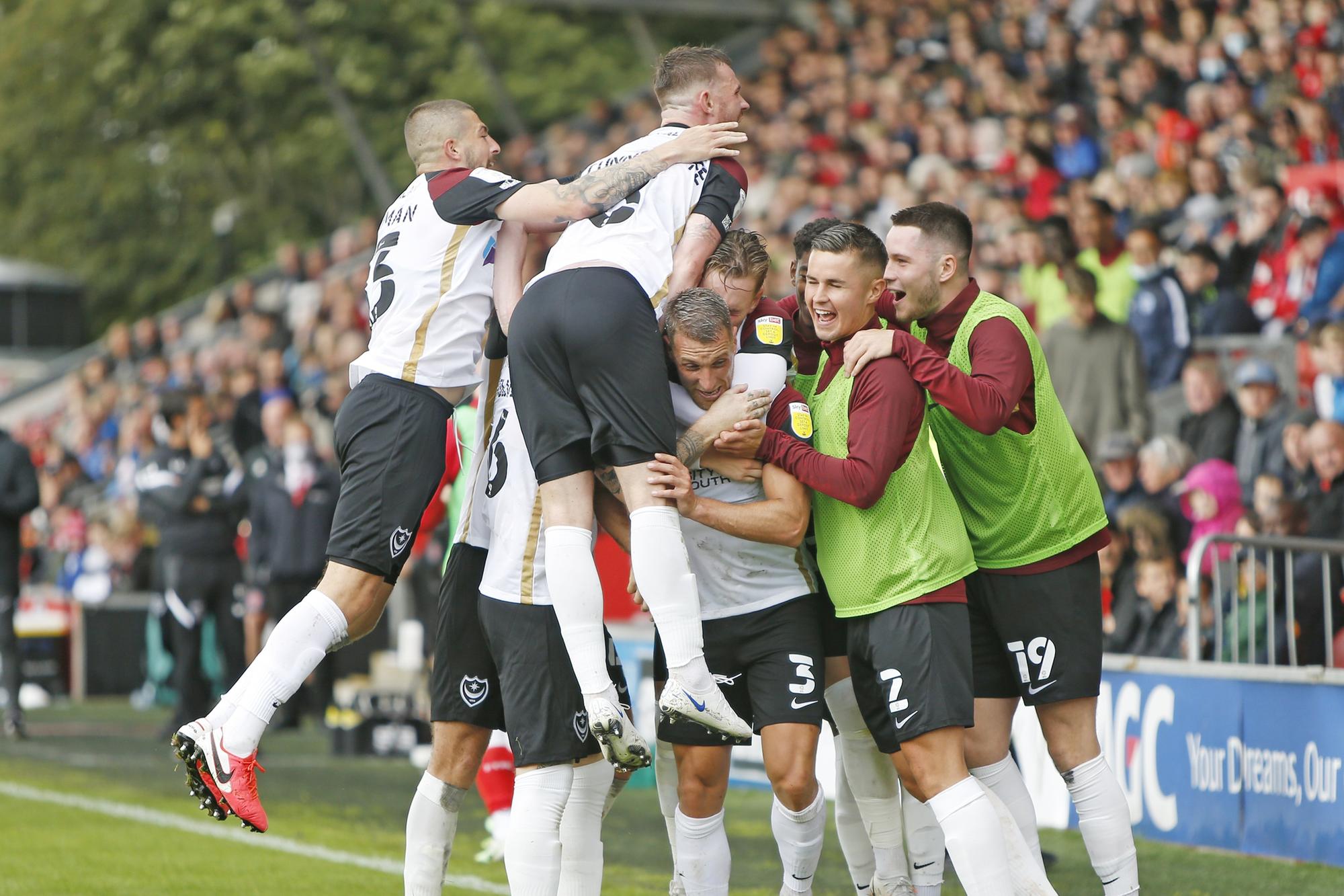 The Pompey players celebrated Lee Brown's 60th-minute striker.  Picture: Paul Thompson/ProSportsImages