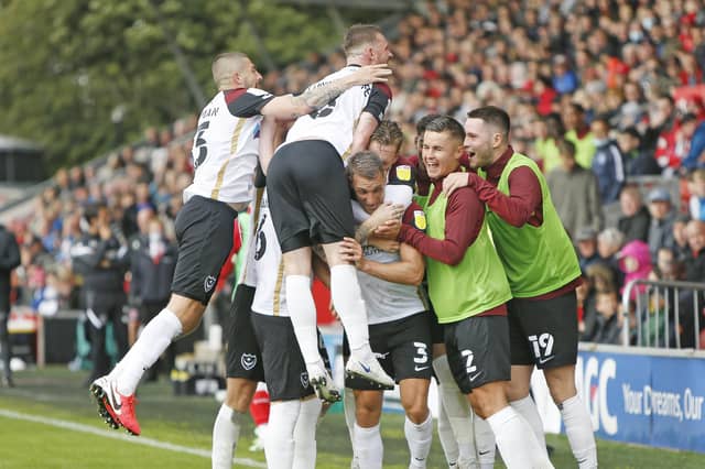 The Pompey players celebrated Lee Brown's 60th-minute striker. Picture: Paul Thompson/ProSportsImages