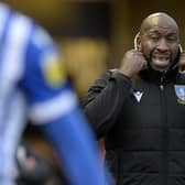 Sheffield Wednesday manager Darren Moore watches on.