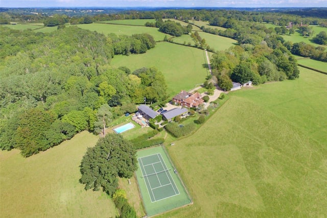 This period country house sits surrounded by more than 100 acres of Land on the outskirts of the village of Wadhurts, and boasts its own pasture, stables, swimming pool and tennis court. Price: £4,500,000.