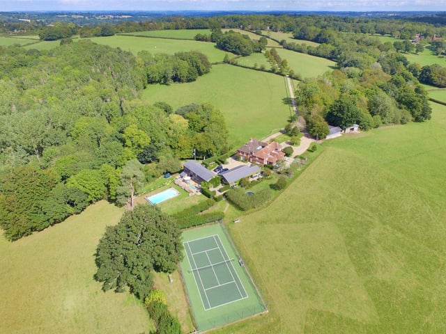 This period country house sits surrounded by more than 100 acres of Land on the outskirts of the village of Wadhurts, and boasts its own pasture, stables, swimming pool and tennis court. Price: £4,500,000.
