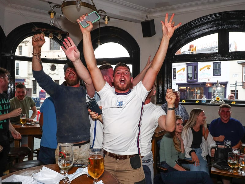 Fans pictured in The Kings pub celebrating as England score their first goal. Picture: Stuart Martin (220421-7042)