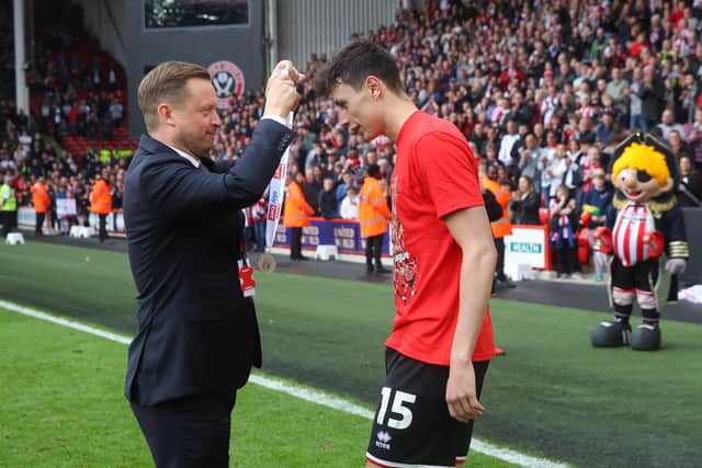 Sheffield United CEO Stephen Bettis presents Anel Ahmedhodzic with his promotion medal: Simon Bellis / Sportimage