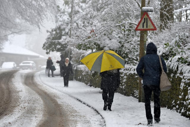 People walking through heavy snow fall, on Lady Lane, Bingley, that caused havoc for the day's commute in March 2018