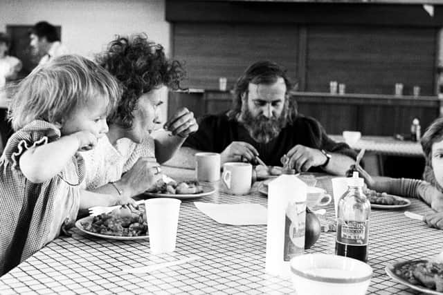 How often do families now gather round the table for a meal? Here is one miner's family in the 1980s eating dinner in the Kellingley Colliery miners' welfare soup kitchen.