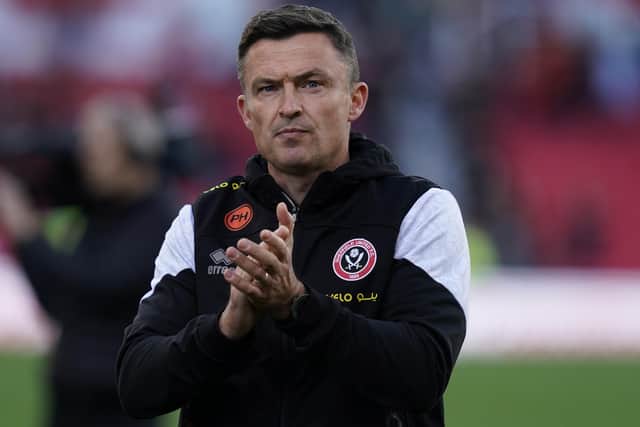 Paul Heckingbottom applauds Sheffield United's travelling fans after defeat at Stoke City this afternoon: Andrew Yates / Sportimage