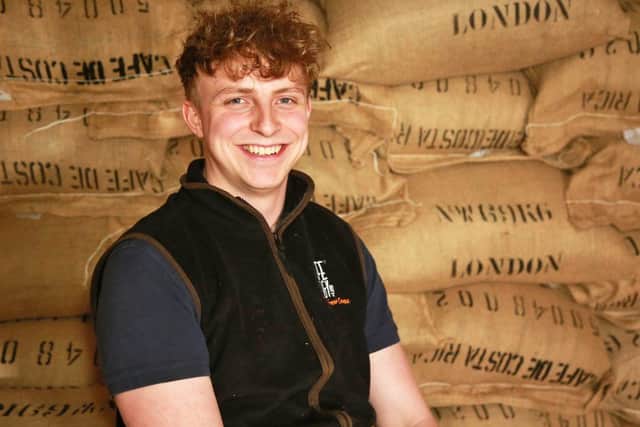 Liam Worsley with the 20-tonne coffee delivery after its 5,000 mile journey to Sheffield. Picture by Visualise It 