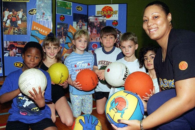 Elandra Farrior of the Sheffield Sharks development team with some of the Y3 pupils at the Nether Green Junior School who received tuition at the school in basketball in November 1997