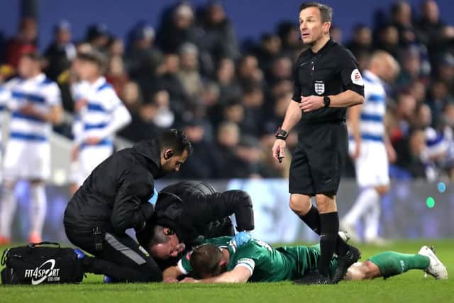 LONDON, ENGLAND - JANUARY 24: Tom Lees reacts to an injury during the FA Cup Fourth Round match between Queens Park Rangers and Sheffield Wednesday at The Kiyan Prince Foundation Stadium on January 24, 2020 in London, England. (Photo by James Chance/Getty Images)