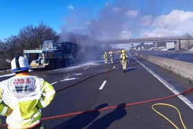 Firefighters battle a crane fire on the M1 near Sheffield. Image courtesy of South Yorkshire Fire and Rescue.