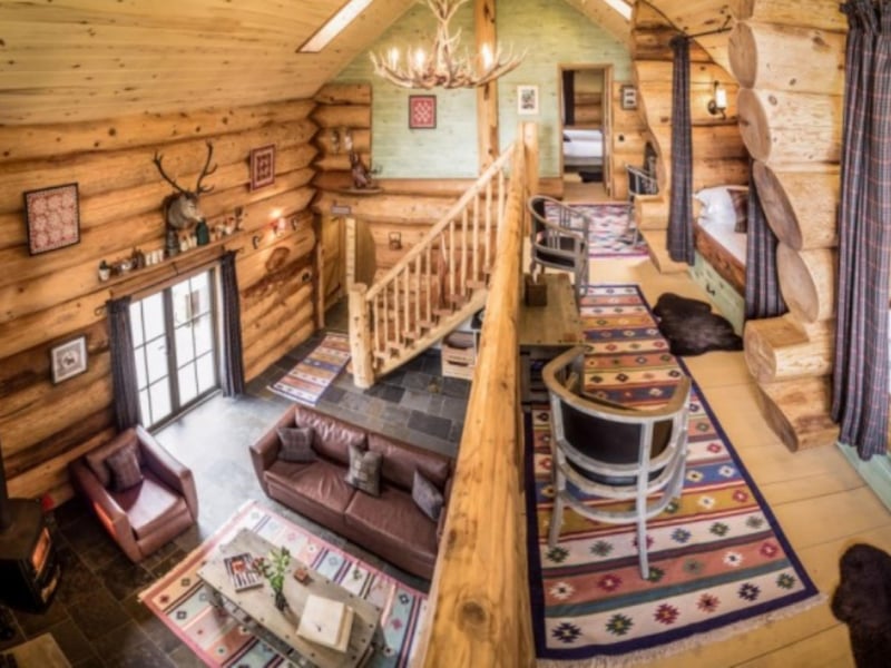 A mezzanine balcony looks down on the living area.
