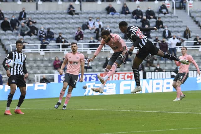 Newcastle's Joe Willock, second from right, scores the opening goal during the English Premier League soccer match between Newcastle United and Sheffield United at St. James' Park in Newcastle, England, Wednesday, May 19, 2021. (Stu Forster/Pool via AP)