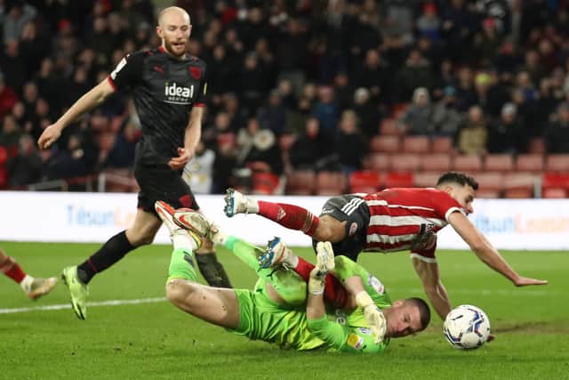 Sam Johnstone of West Bromwich Albion saves at the feet of George Baldock of Sheffield United: Simon Bellis / Sportimage