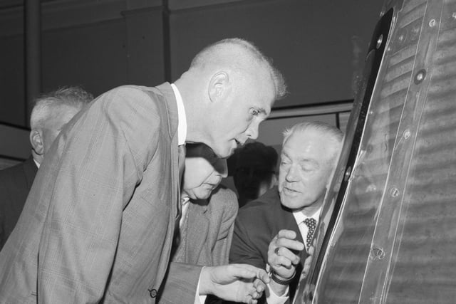 US astronaut Colonel John Glenn looks at the Freedom 7 space capsule in the Royal Museum of Scotland in June 1966.