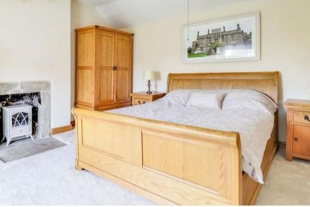 An oak staircase leads to the first floor, where two large double bedrooms can be found.