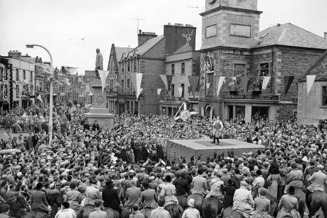 Selkirk Common Riding, June 1954. The flag bearer casts the colours.