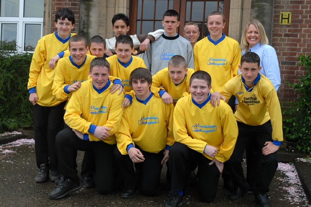 Harton Year 10 footballers sport their new sponsored shirts supplied by Machining Techniques. Pictured with them is company secretary Diane Ditchburn.