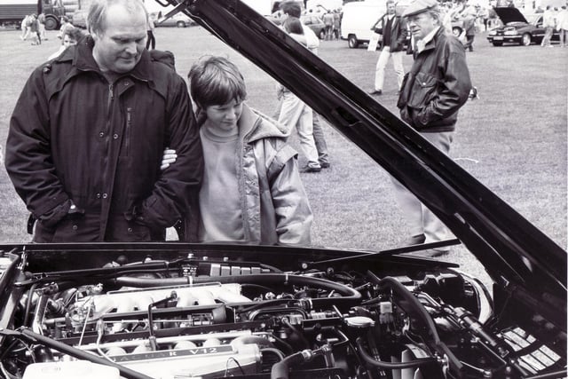 Sheffield Motor Show & Family Gala
Graves Park, Sheffield - 9 June 1991
Mr Don Fairey and his son Ian, aged 10, of Little Norton Lane, Sheffield, pictured inspecting the engine of a Jaguar XJS V12 on show by Hatfields of Sharrow Lane, Sheffield