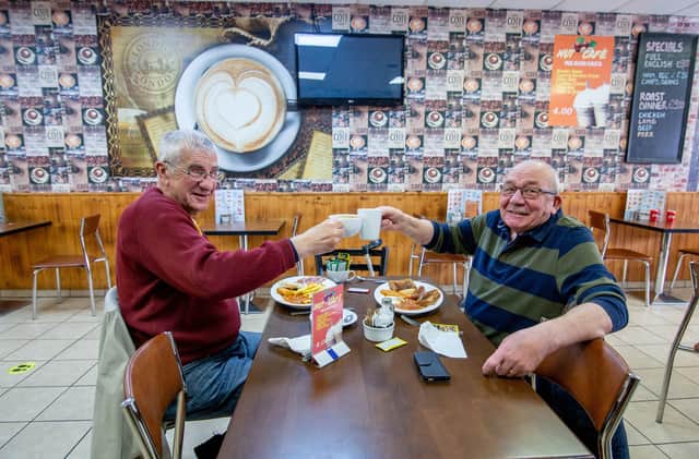 Friends veteran Clive Sutton and Ian Noble get together in Cafe Nut, Portsmouth. Picture: Habibur Rahman