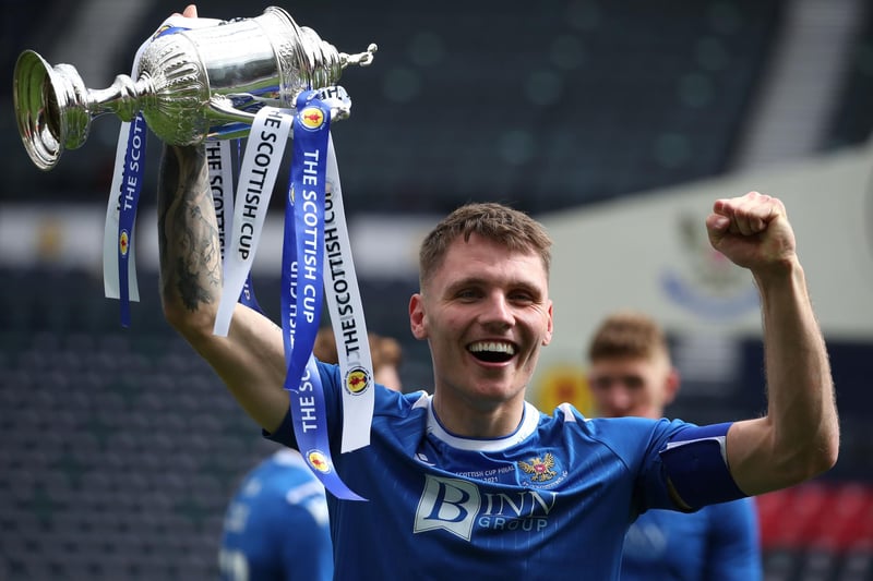St Johnstone's Jason Kerr lifts the trophy after the final whistle during the Scottish Cup final match at Hampden Park, Glasgow