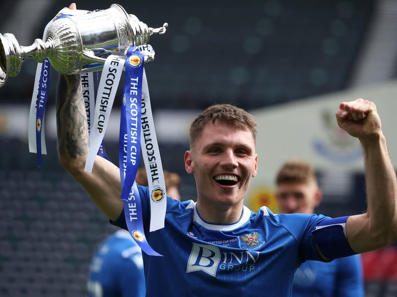 St Johnstone's Jason Kerr lifts the trophy after the final whistle during the Scottish Cup final match at Hampden Park, Glasgow