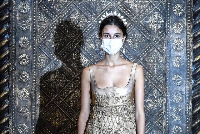 A model wears a creation by Christian Dior's during a fitting session
