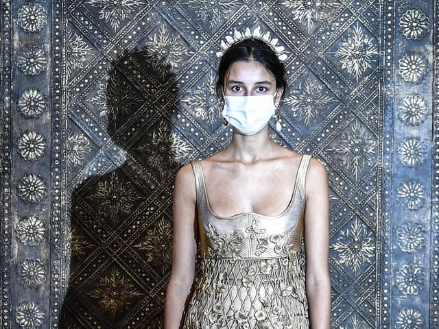 A model wears a creation by Christian Dior's during a fitting session