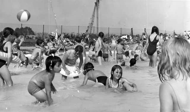 Looks like fun! Children enjoying the splash pool in August 1973