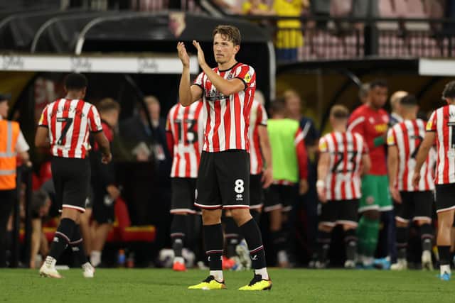 Sander Berge of Sheffield United applauds the fans after the defeat at Watford: Jonathan Moscrop / Sportimage