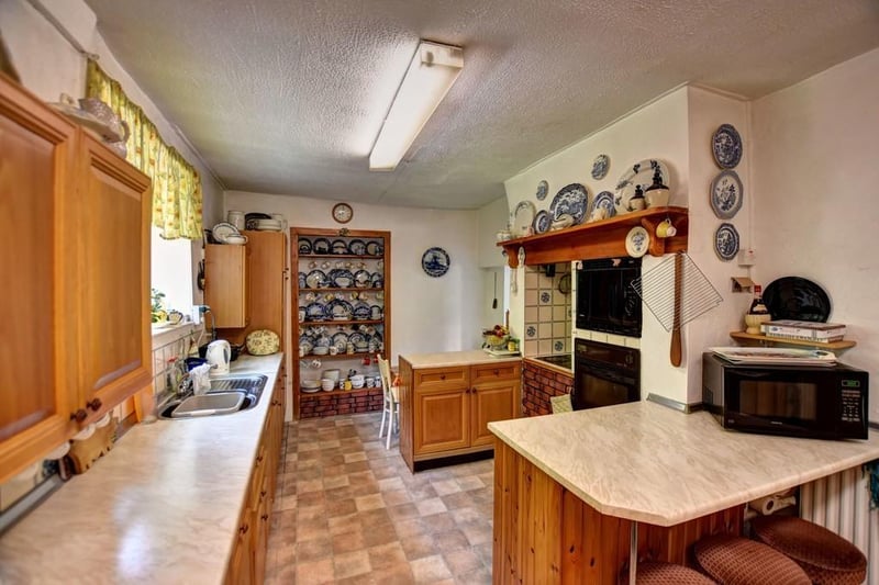 The kitchen has retained original features, which gives the room character.