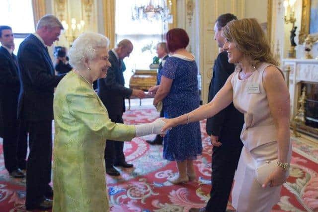 Debbie Harrison OBE, boss of Pricecheck Toiletries, meets the Queen.