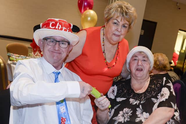 Gloria Stewart with some of the people at a previous Home Alone Christmas Party she has organised at Niagara Centre in Sheffield