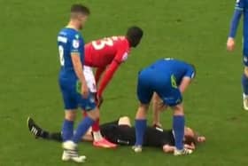 A well-struck clearance by Sheffield Wednesday youngster Ciaran Brennan - on loan at Swindon Town - caused injury to referee Sam Purkiss.