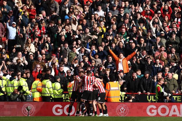 Tommy Doyle of Sheffield United celebrates with teammates and fans after scoring against Blackburn Rovers (Naomi Baker/Getty Images)
