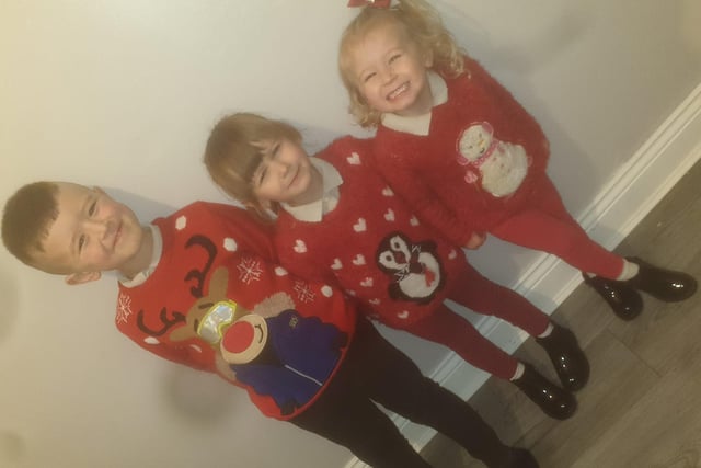 Three Christmas grins from Ashton, 6, Aura, 4 and Aria, 3.