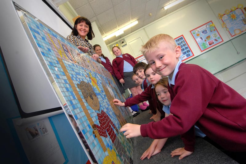 A new mosaic for the school and it was created by students in 2010. Were you in the picture with head teacher Moya Rooney?