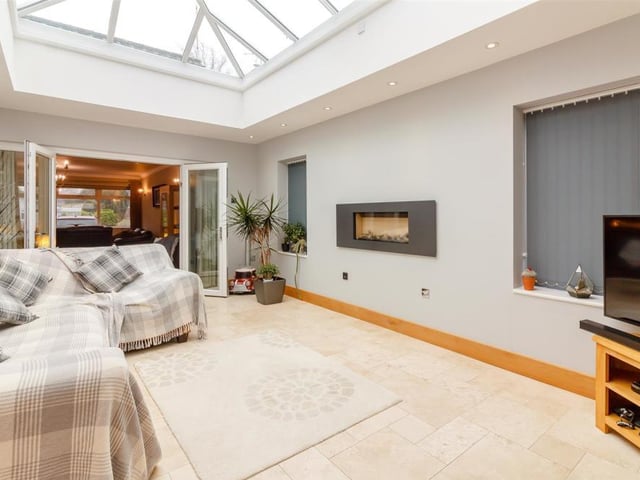 A second glance at the orangery. At one end, a set of French doors lead to the lounge, while at the other, bi-fold doors guide you out into the back garden. There are also two double-glazed windows to the side of the bungalow.