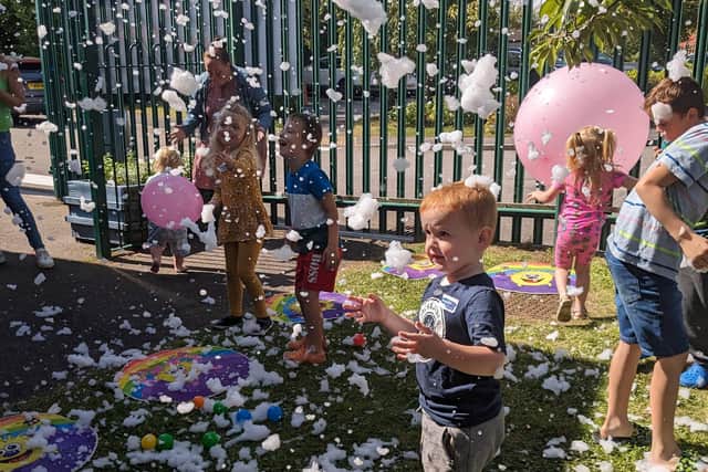 Children having fun at a foam party being held at a Family Hub in Barnsley - Sheffield has seven Family Hubs across the city