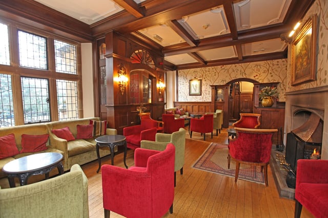 The property boasts a lobby, part-panelled reception hall, drawing room with ceiling mouldings and working fireplaces.