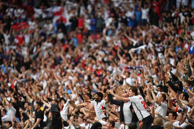TOPSHOT - England supporters celebrate their win in the UEFA EURO 2020 round of 16 football match between England and Germany at Wembley Stadium in London on June 29, 2021. (Photo by JUSTIN TALLIS / POOL / AFP) (Photo by JUSTIN TALLIS/POOL/AFP via Getty Images)