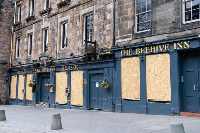 Deserted streets in Grassmarket, Edinburgh, where The Beehive Inn has been pictured with boarded up windows